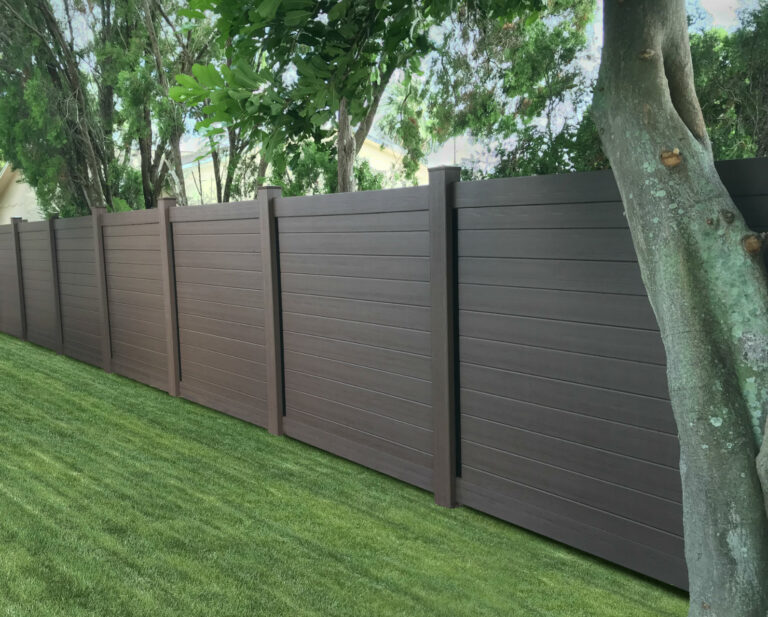 Brown custom vinyl tongue and groove privacy fence
