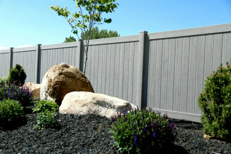 Garden with vinyl fence.