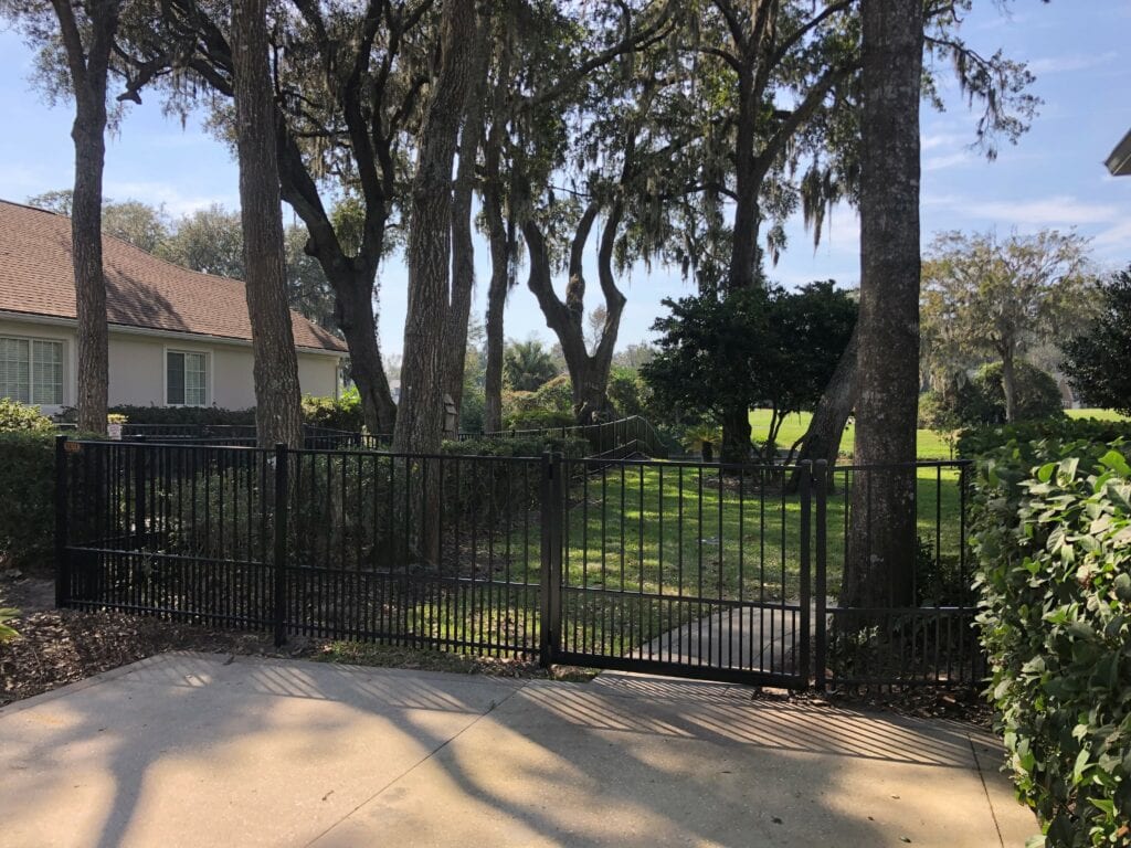 Black aluminum fence with large gate