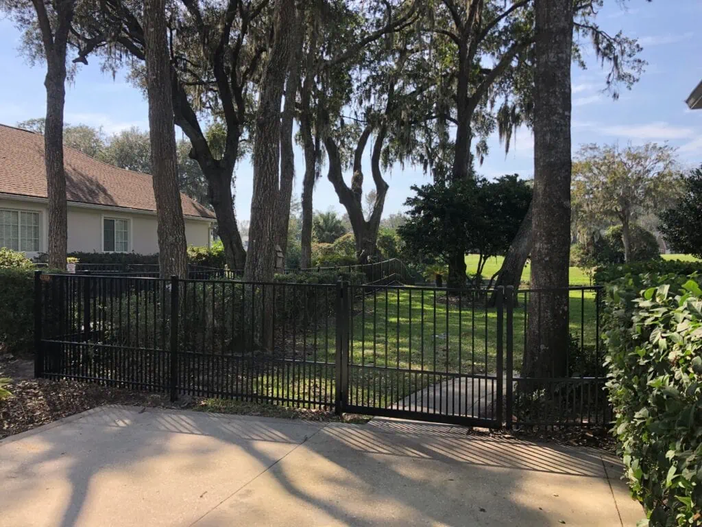 Black aluminum fence with large gate