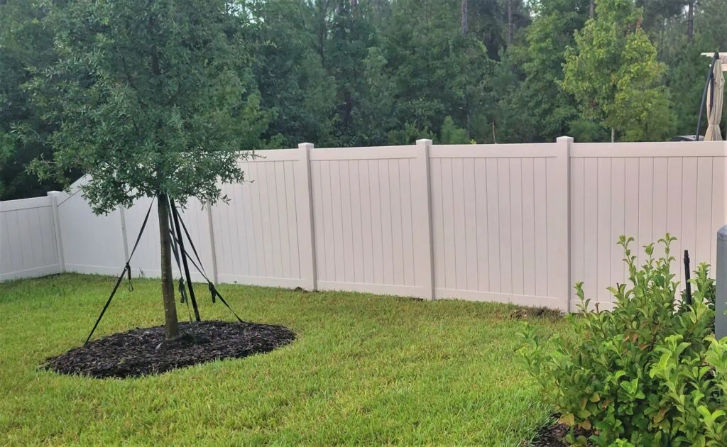 Vinyl fence along property line