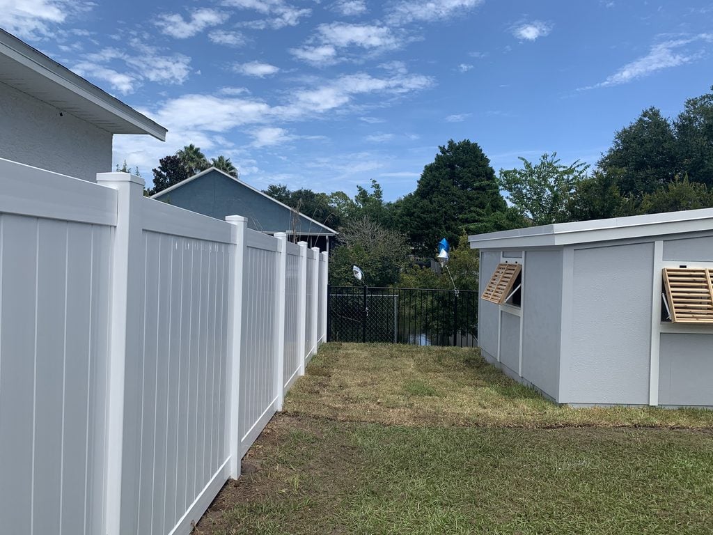 White Vinyl Fence and Black Aluminum Fence