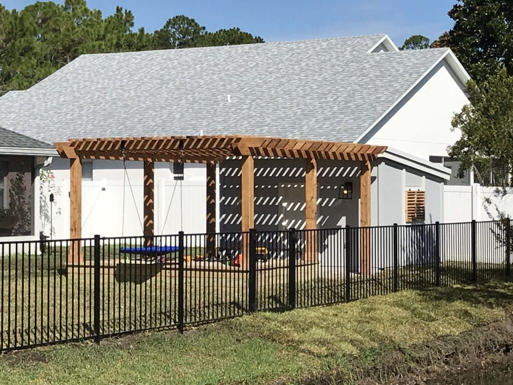 Suburban house with black aluminum backyard fence
