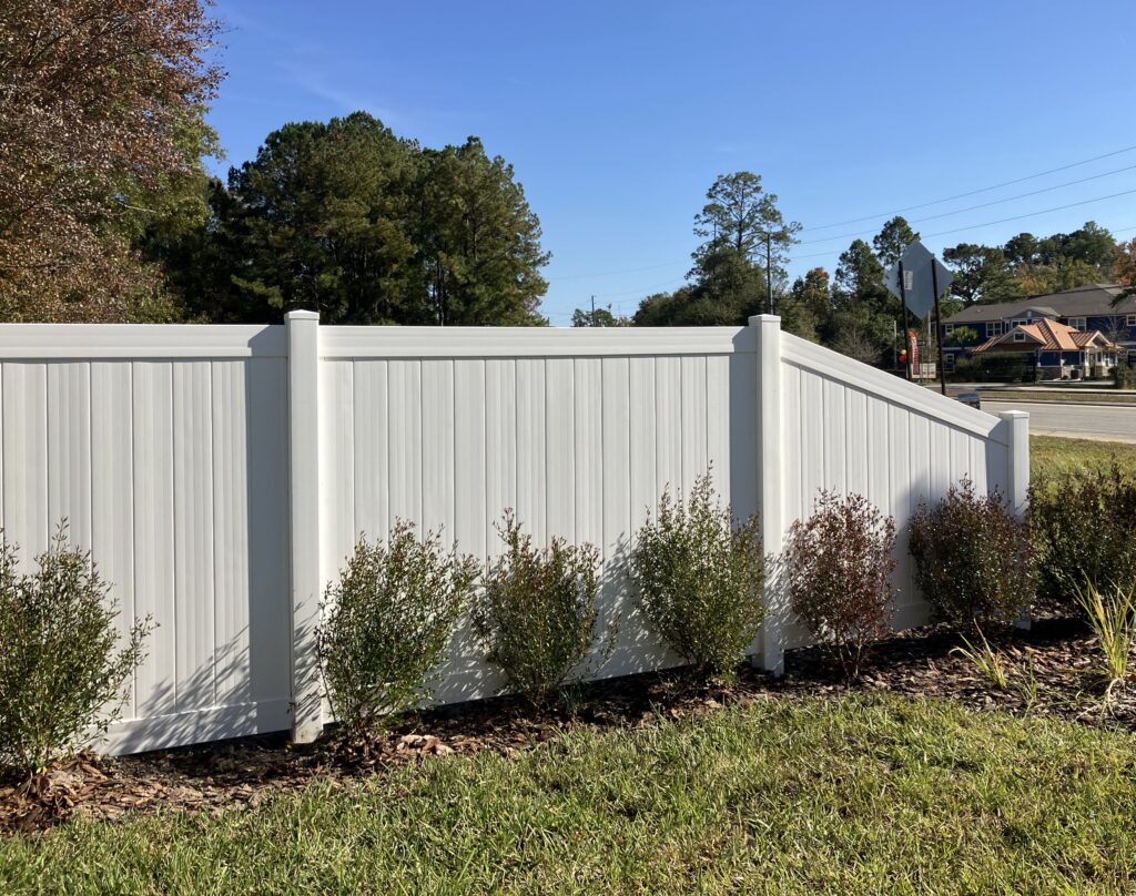White vinyl transition fence