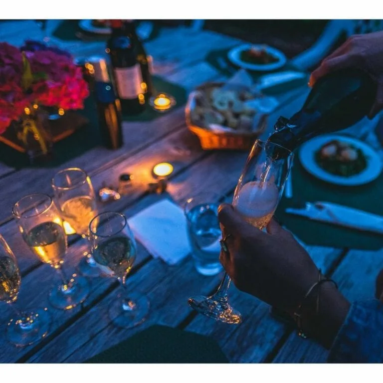 Table with food and glasses.