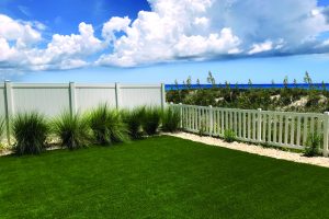 Custom vinyl privacy fence on beachfront