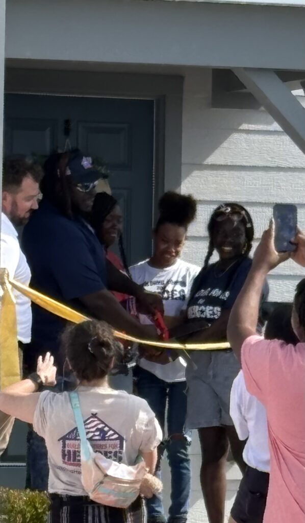 Reveal day for the honored Veteran. Red carpet on the driveway for the family to walk up to house.