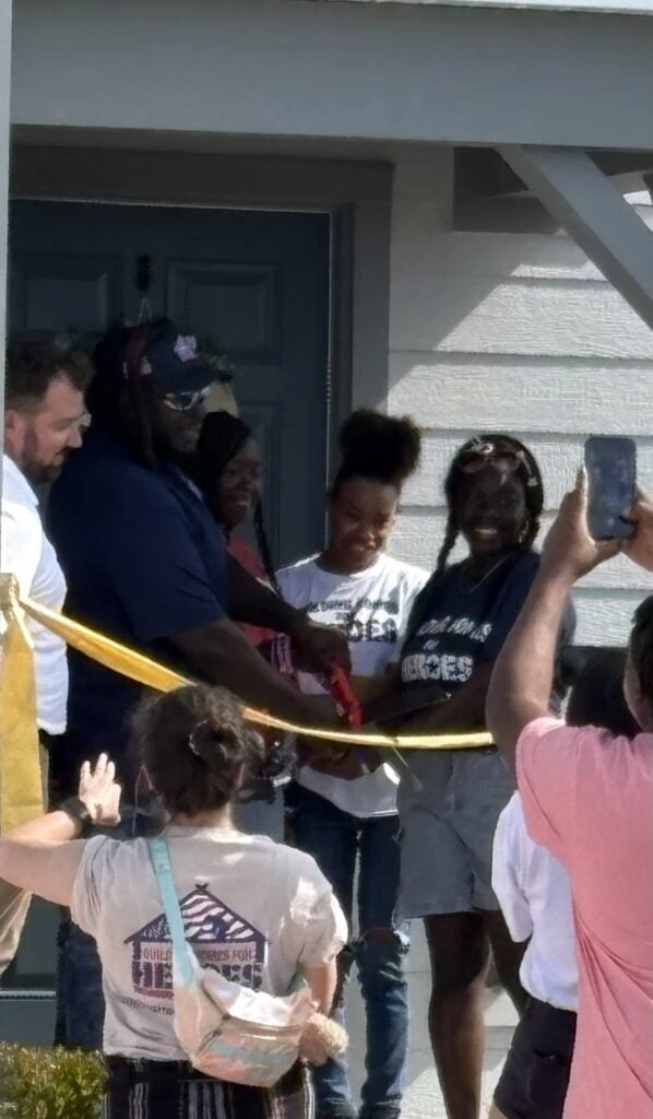 Reveal day for the honored Veteran. Red carpet on the driveway for the family to walk up to house.