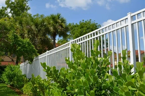 White aluminum fence along property line